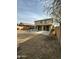 Desert landscaping, covered patio and a two-story home exterior at 300 S 151St Ave, Goodyear, AZ 85338