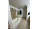 Bathroom with a separate tub and shower, tile flooring, and a vanity at 300 S 151St Ave, Goodyear, AZ 85338