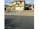 Two-story home with a two-car garage and a paved driveway at 300 S 151St Ave, Goodyear, AZ 85338