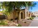 Attractive home exterior with a covered entryway and mature tree at 3656 W Bryce Ct, Phoenix, AZ 85086