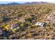 Scenic aerial view of a desert community nestled against the backdrop of majestic mountains at 36701 N Porta Nuova Rd, Scottsdale, AZ 85262