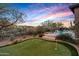 Private backyard with putting green, pool, and spa at 36701 N Porta Nuova Rd, Scottsdale, AZ 85262