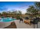 Inviting backyard oasis with pool, fire pit, and stunning sunset views at 36701 N Porta Nuova Rd, Scottsdale, AZ 85262