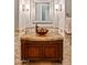 Elegant bathroom with granite countertop, vessel sink, and decorative mirror at 36701 N Porta Nuova Rd, Scottsdale, AZ 85262
