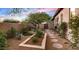 Private courtyard with lush desert landscaping and walkway at 36701 N Porta Nuova Rd, Scottsdale, AZ 85262