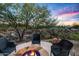 Outdoor fire pit with seating area, ideal for enjoying desert evenings at 36701 N Porta Nuova Rd, Scottsdale, AZ 85262