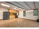 Spacious three-car garage with built-in cabinets and epoxy flooring at 36701 N Porta Nuova Rd, Scottsdale, AZ 85262
