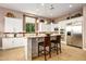 Bright kitchen with island, stainless steel appliances, and white cabinetry at 36701 N Porta Nuova Rd, Scottsdale, AZ 85262