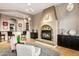 Cozy living room with fireplace, wet bar, and comfortable seating at 36701 N Porta Nuova Rd, Scottsdale, AZ 85262