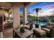 Relaxing covered patio with comfortable seating, pool views, and a patio heater at 36701 N Porta Nuova Rd, Scottsdale, AZ 85262