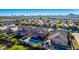 Aerial view of a residential area featuring houses with pools and lush landscaping at 36909 N Coronado Ln, San Tan Valley, AZ 85140