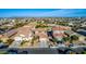 Aerial view of a residential neighborhood with houses and a mountain backdrop at 36909 N Coronado Ln, San Tan Valley, AZ 85140