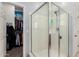 Bathroom with walk-in shower and adjacent closet at 36909 N Coronado Ln, San Tan Valley, AZ 85140