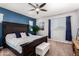 Spacious bedroom with dark wood furniture and blue accent wall at 36909 N Coronado Ln, San Tan Valley, AZ 85140