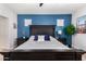 Spacious bedroom with dark wood furniture and blue accent wall at 36909 N Coronado Ln, San Tan Valley, AZ 85140