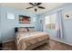 Bedroom with light blue walls and a comfortable bed at 36909 N Coronado Ln, San Tan Valley, AZ 85140