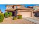 Two-story house with a two-car garage and well-maintained landscaping at 36909 N Coronado Ln, San Tan Valley, AZ 85140