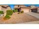 Front yard view of two story house with bushes and rock landscaping at 36909 N Coronado Ln, San Tan Valley, AZ 85140