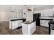 Modern kitchen with white cabinets, granite countertops, and island at 36909 N Coronado Ln, San Tan Valley, AZ 85140