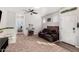 Cozy playroom features a leather couch, ' table, and plenty of storage at 36909 N Coronado Ln, San Tan Valley, AZ 85140