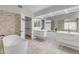 Modern bathroom with dual vanity, soaking tub, walk-in closet, and tile floor at 4018 E Goldfinch Gate Ln, Phoenix, AZ 85044