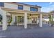 Covered patio with hanging plants and pavers at 4018 E Goldfinch Gate Ln, Phoenix, AZ 85044