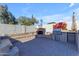 Outdoor kitchen with built-in grill, fireplace and refrigerator at 4018 E Goldfinch Gate Ln, Phoenix, AZ 85044