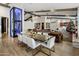 Elegant dining area with a glass table and modern chairs, adjacent to a wine cellar at 611 N Tamarisk St, Chandler, AZ 85224