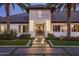 Modern home's inviting entryway, featuring a sleek design and landscape at 611 N Tamarisk St, Chandler, AZ 85224