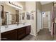 Bathroom with double sinks, vanity, and a walk-in shower at 6202 E Mckellips Rd # 66, Mesa, AZ 85215