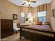 Cozy bedroom with dark wood furniture and warm-toned bedding at 6202 E Mckellips Rd # 66, Mesa, AZ 85215