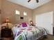 Bedroom with floral bedding, ceiling fan, and sliding closet doors at 6202 E Mckellips Rd # 66, Mesa, AZ 85215