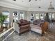 Clubhouse sitting area with comfortable seating, large windows, and holiday decor at 6202 E Mckellips Rd # 66, Mesa, AZ 85215