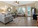 Inviting living room with comfortable seating, tile flooring, and access to the backyard at 6202 E Mckellips Rd # 66, Mesa, AZ 85215