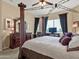 Main bedroom with a four-poster bed, dresser, and a window view at 6202 E Mckellips Rd # 66, Mesa, AZ 85215