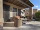 Covered patio with wicker furniture and a glass-top table at 6202 E Mckellips Rd # 66, Mesa, AZ 85215