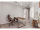 Home office featuring desk, chair, and neutral decor at 7120 W Maya Way, Peoria, AZ 85383