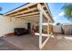 Covered patio with seating area and storage shed at 906 W Danbury Rd, Phoenix, AZ 85023