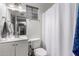 Simple bathroom with white vanity, toilet and shower at 906 W Danbury Rd, Phoenix, AZ 85023