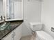 Modern bathroom with a glass vessel sink and granite countertop at 11444 N 28Th Dr # 13, Phoenix, AZ 85029