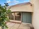Inviting front door with a green finish, flanked by large windows, and a tiled walkway at 11444 N 28Th Dr # 13, Phoenix, AZ 85029
