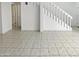 Bright living room with tiled flooring and staircase at 11444 N 28Th Dr # 13, Phoenix, AZ 85029