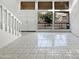 Spacious living room with tiled floors, white walls, and abundant natural light at 11444 N 28Th Dr # 13, Phoenix, AZ 85029