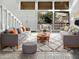 Bright living room with high ceilings, large windows, and modern furniture at 11444 N 28Th Dr # 13, Phoenix, AZ 85029