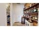 Pantry area with ample shelving and a built-in wet bar at 14959 S 184Th Ave, Goodyear, AZ 85338