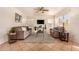 Cozy living room with two sofas, coffee table, ceiling fan, and tiled floor at 1611 W Cindy St, Chandler, AZ 85224