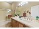 Clean bathroom with shower, single vanity, and white tiles at 1613 W Ainsworth Dr, Anthem, AZ 85086