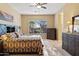 Bedroom with large bed, dresser, and window at 1613 W Ainsworth Dr, Anthem, AZ 85086