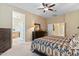 Large bedroom with a king-size bed, dresser, and soft carpet at 1613 W Ainsworth Dr, Anthem, AZ 85086