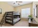 ' bedroom featuring bunk beds and a window with blinds at 1613 W Ainsworth Dr, Anthem, AZ 85086